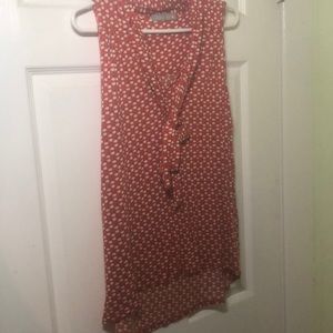 Red patterned sleeveless blouse